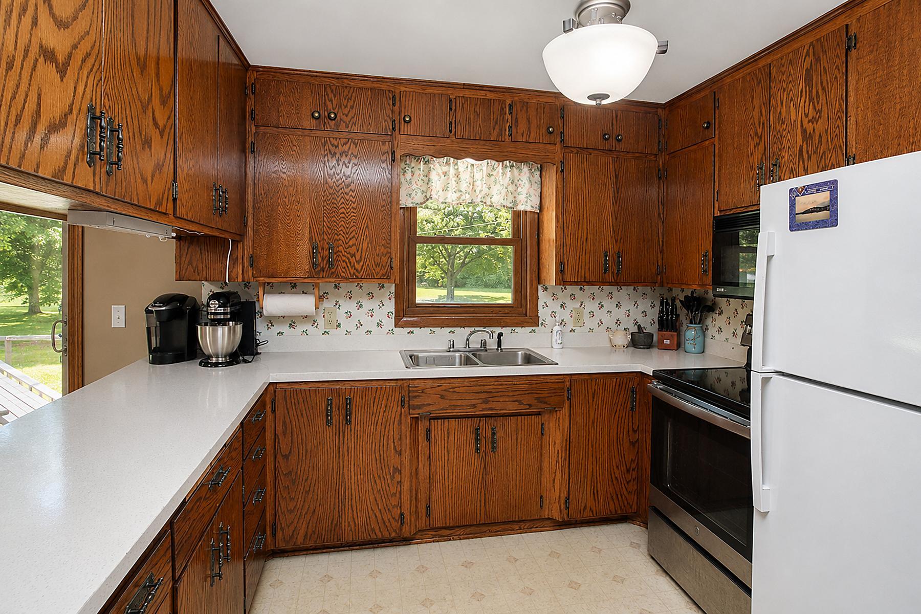 Kitchen has an abundance of cabinets and counter space for entertaining and family meal time