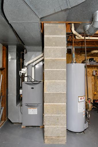 Clean utility area includes new water heater