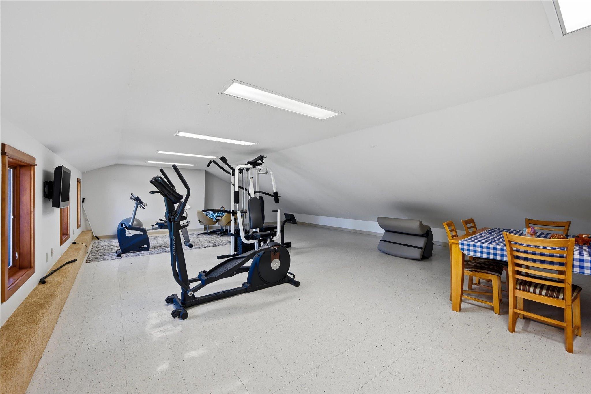 Upper level bonus room is currently used as workout area and crafting room.