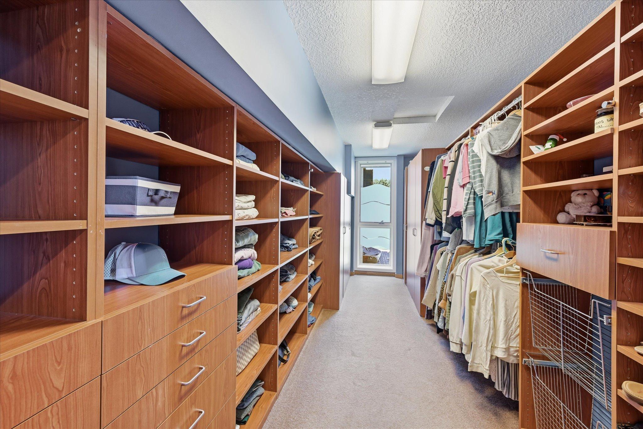 Huge walk in closet in main floor primary bedroom suite!