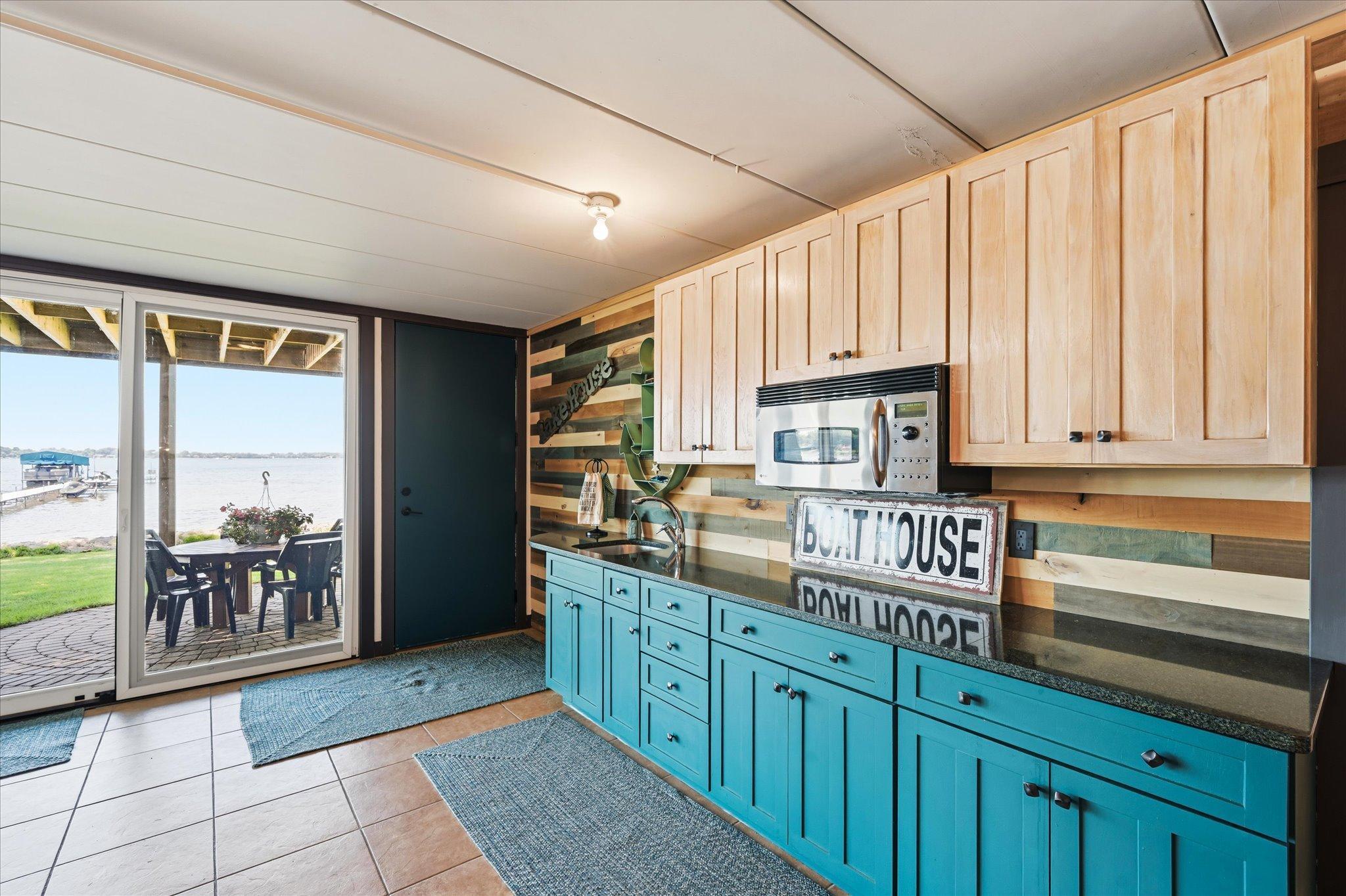 Full wetbar area in "boathouse" entertaining area.