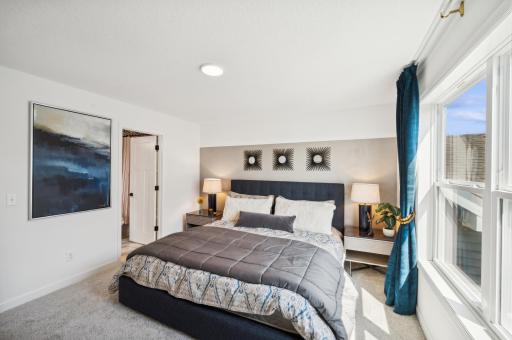 The owner's bedroom is spacious and offers a place to retreat to *Photo of actual home