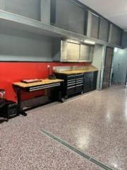Garage work bench stays! So much storage inside the garage and above with staircase pulldown