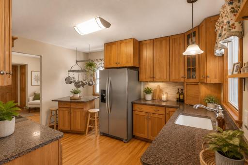 Beautifully updated kitchen w/Brand new appliances, granite counters and moveable center island