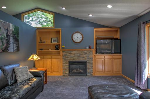 Main Level Family room with gas burning fireplace.