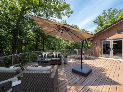 Another look at the size of this deck and besides being surrounded by all of the trees notice the sunshine. Again--there is a gas line here for a grill.