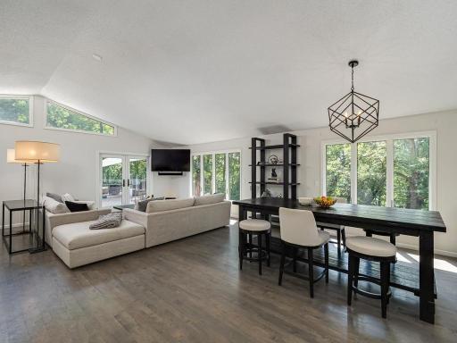 A dining area that can accommodate any size and shape of your choice of table and furniture. To the left is the main floor family room which is larger than it appears here. The size and number of windows keep this area nice and bright.