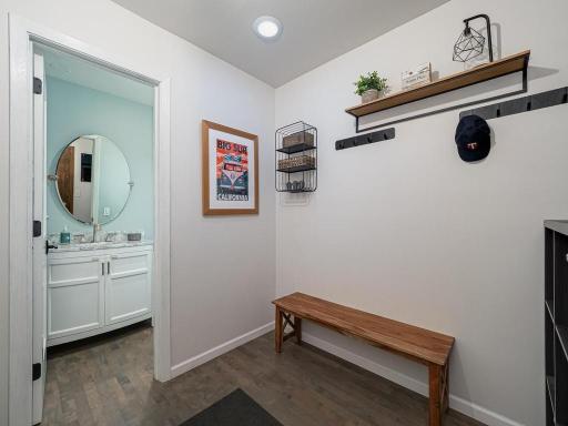 A convenient mud room as you enter from the garage along with a half bath.
