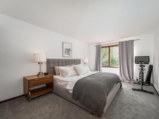 The 19 X11 Primary bedroom. All bedrooms on this level face the lake and the mature trees.