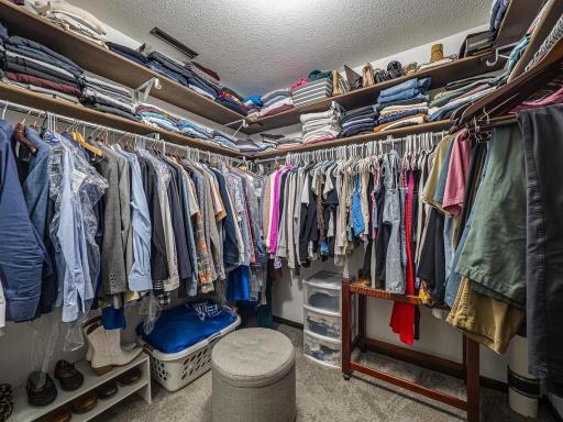 The walk-in Primary bedroom closet.