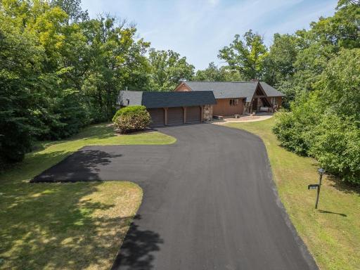Photo for 335 Pineview Lane N, Plymouth, MN 55441 - listing #7113147 As you enter 335 Pineview Lane you are greeted by an abundance of green grass, mature trees and a huge driveway (new in 2026) large enough to handle guests, family holidays and just about everything else-- plus the garage is heated.