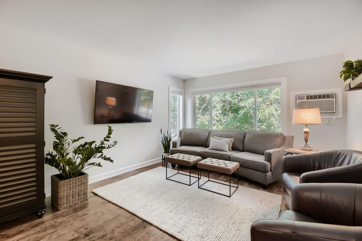 Light filled living room and wall unit cooling system.