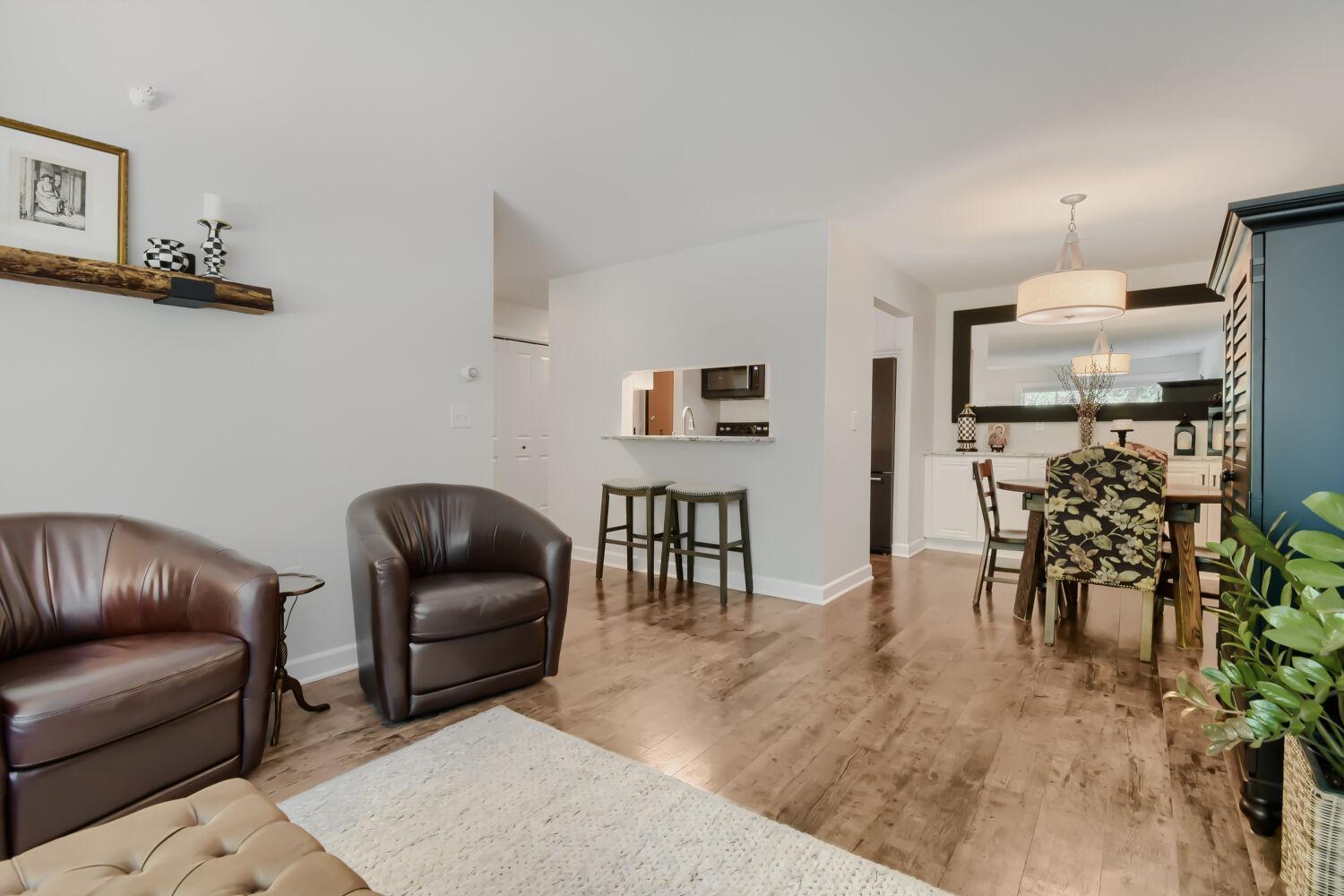 Living room flows from kitchen and dining area