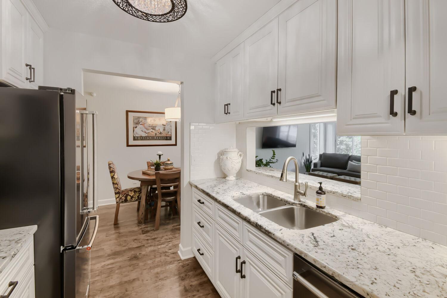 Remodeled Kitchen to include granite countertop, new cabinetry and stainless steel appliances.