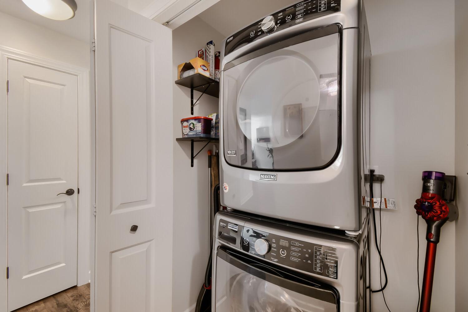 Stackable washer and dryer in unit.