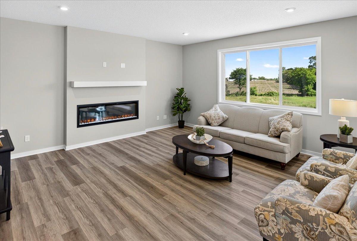 PHOTO OF A DIFFERENT HOME WITH SIMILAR PLAN AND FINISHES.