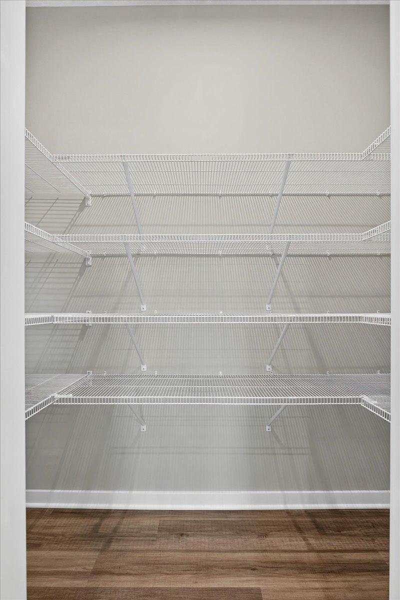 PHOTO OF A DIFFERENT HOME WITH SIMILAR PLAN AND FINISHES. Kitchen Walk-in Pantry.