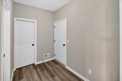 PHOTO OF A DIFFERENT HOME WITH SIMILAR PLAN AND FINISHES. Mudroom.