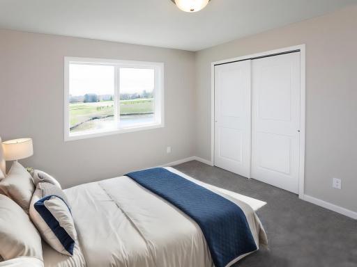 PHOTO OF A DIFFERENT HOME WITH SIMILAR PLAN AND FINISHES VIRTUALLY STAGED. Bedroom 4