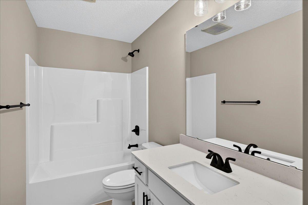 PHOTO OF A DIFFERENT HOME WITH SIMILAR PLAN AND FINISHES. Upper Full Bathroom.