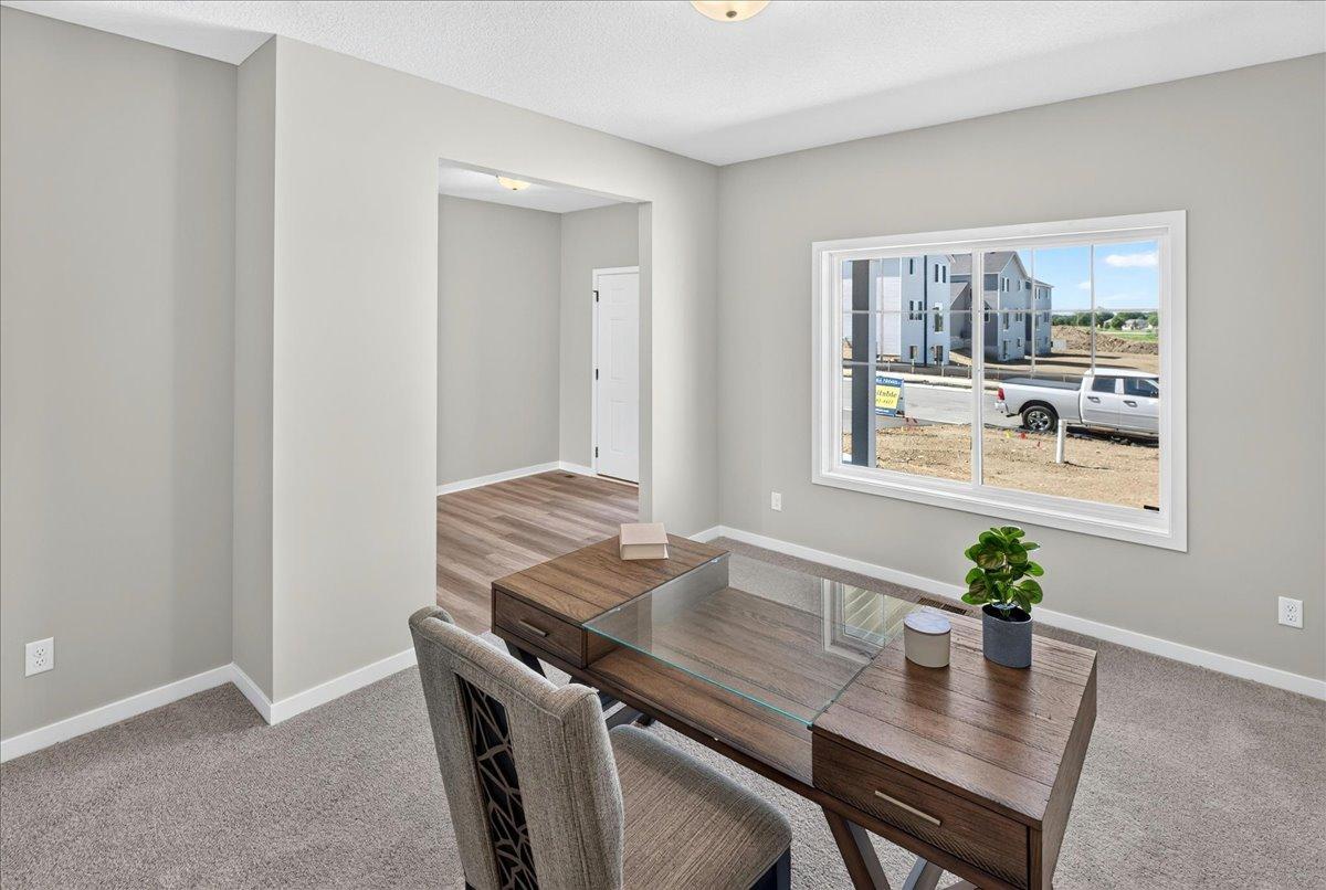 PHOTO OF A DIFFERENT HOME WITH SIMILAR PLAN AND FINISHES. Flex Room.