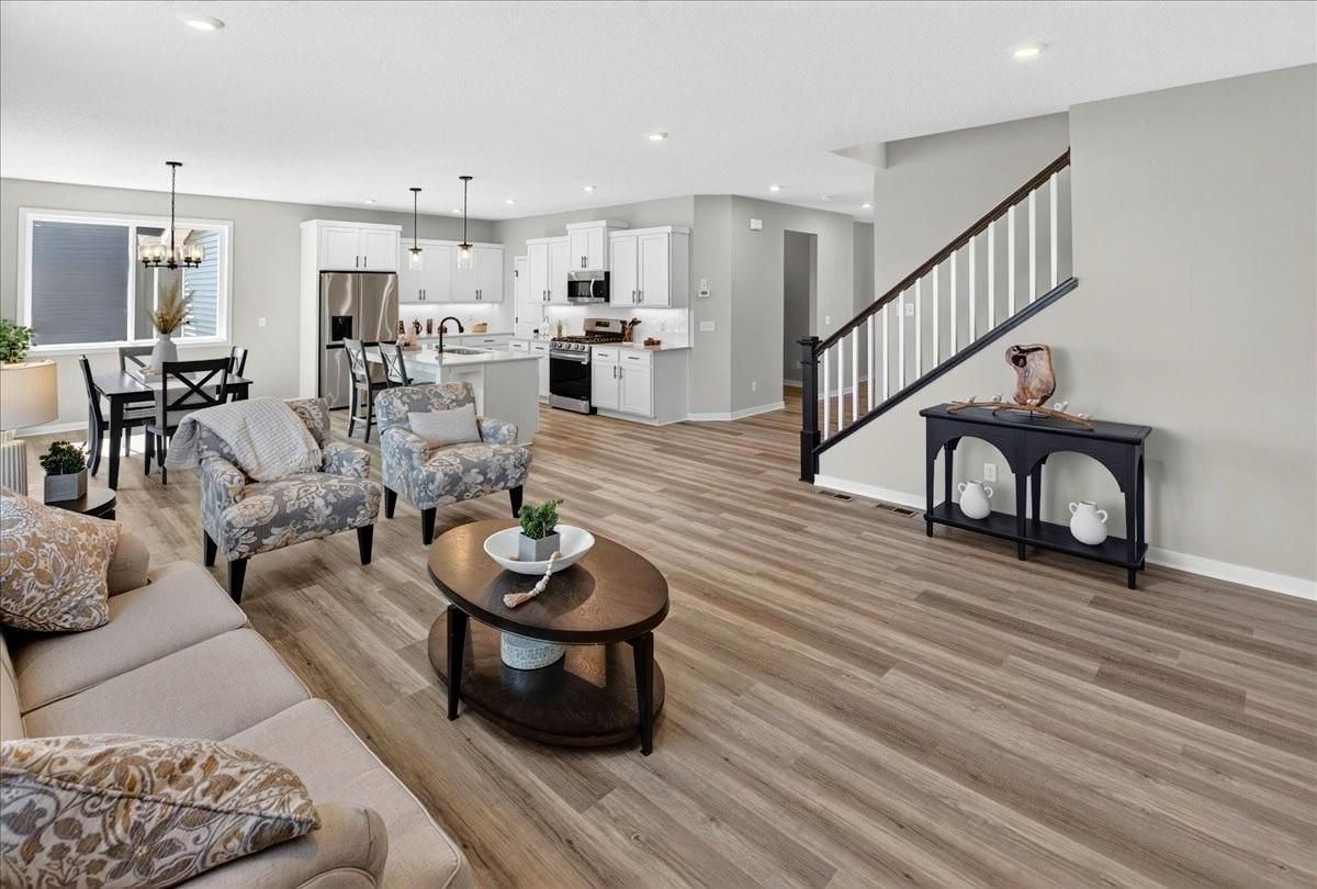 PHOTO OF A DIFFERENT HOME WITH SIMILAR PLAN AND FINISHES.