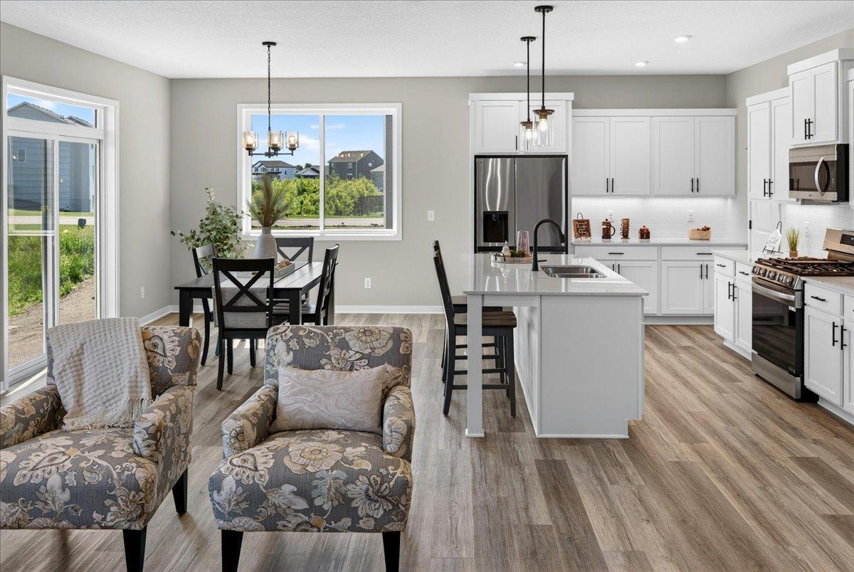 PHOTO OF A DIFFERENT HOME WITH SIMILAR PLAN AND FINISHES.