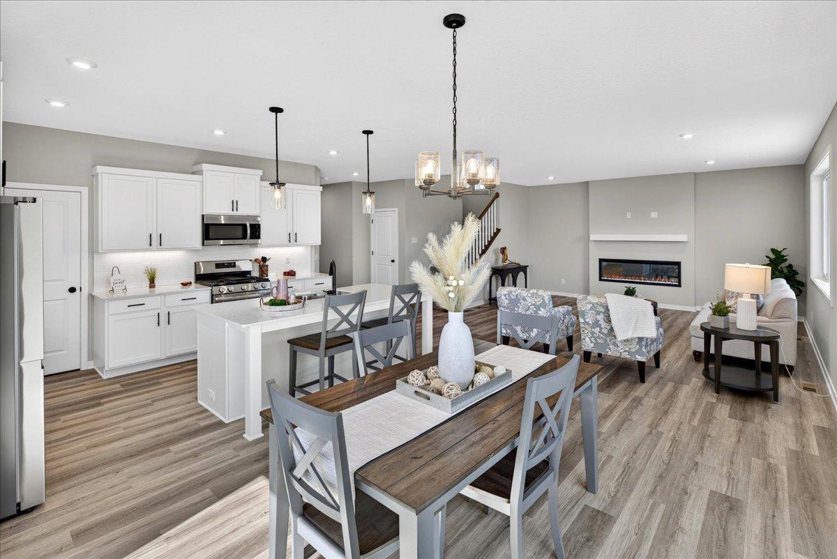 PHOTO OF A DIFFERENT HOME WITH SIMILAR PLAN AND FINISHES.