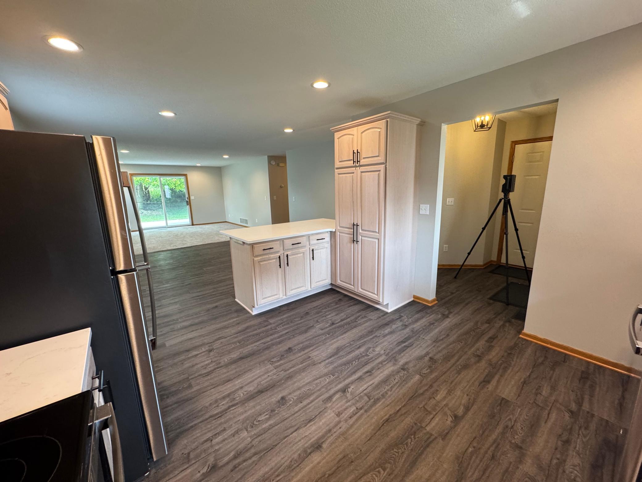 Kitchen facing front door and garage