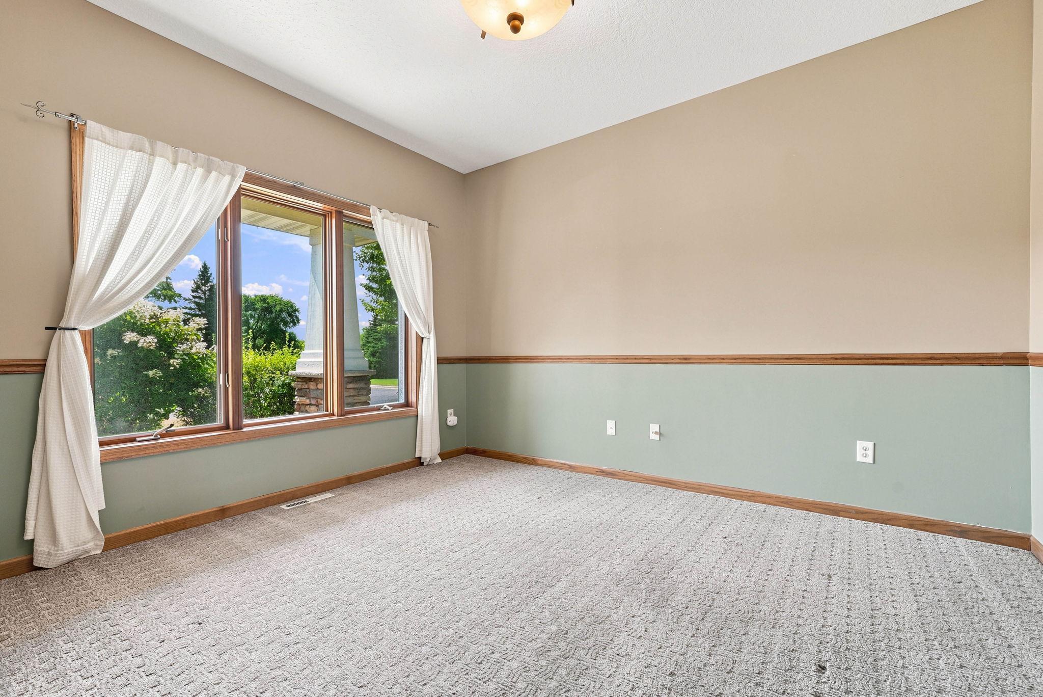 Beautiful front room that's perfect for an office or additional seating room.