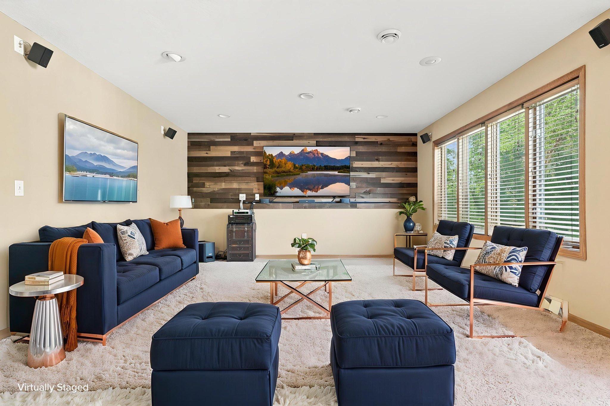 Virtually staged lower level entertainment area. 75in TV and audio system to remain with the home!