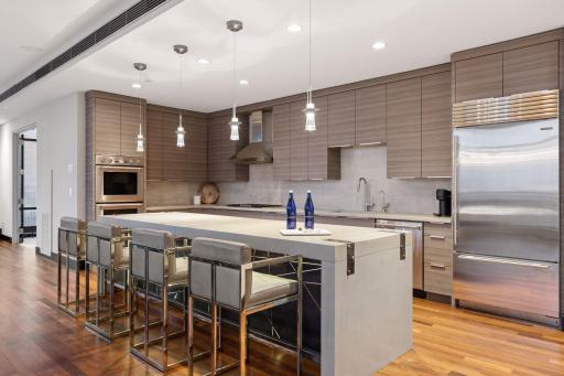 The sleek modern kitchen with professional appliances makes entertaining a joy...