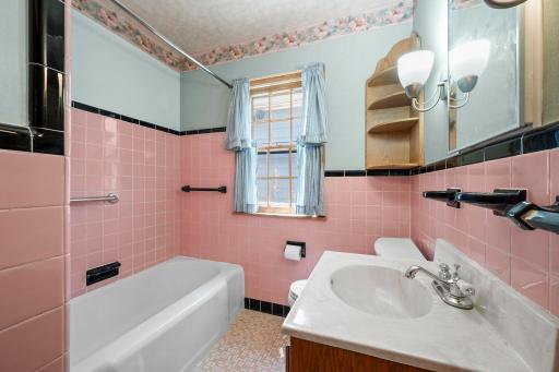 Fabulous pink & black tile bathroom