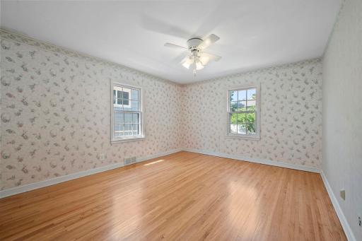 Main floor primary bedroom faces Thomas Ave N