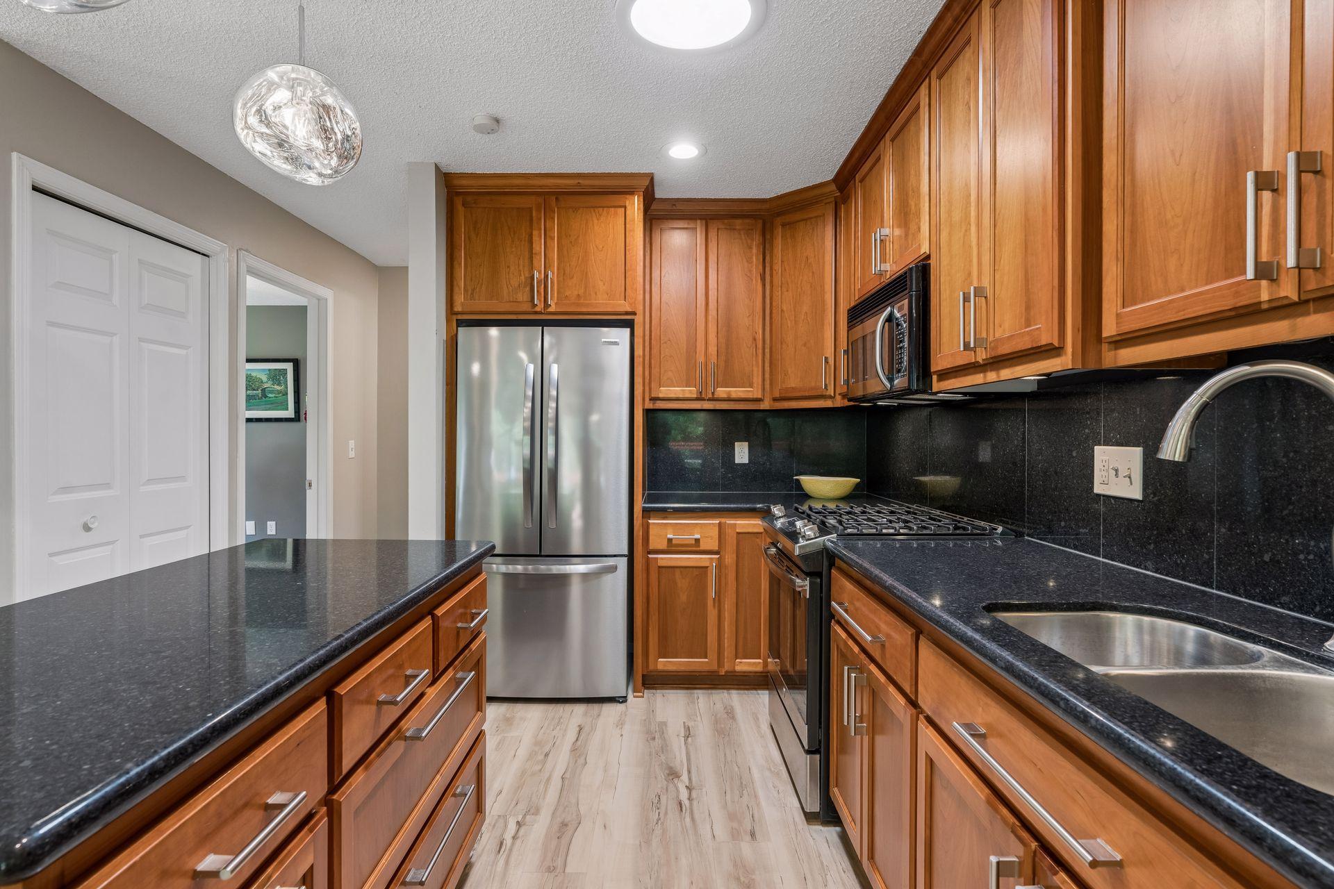 Stainless steel appliances and a pantry for extra storage