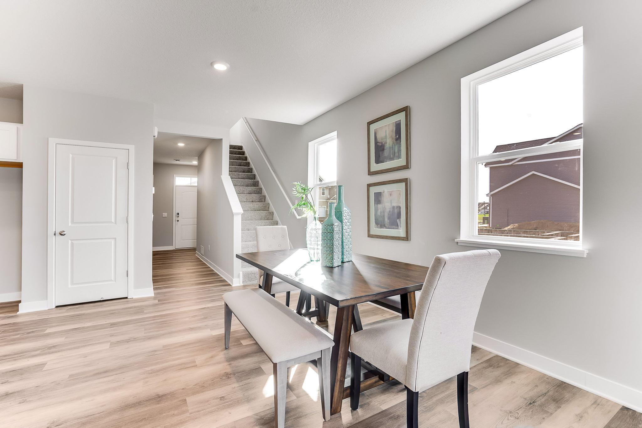 Large dining room space with many options for furniture arrangement. *Photo is of a model home.