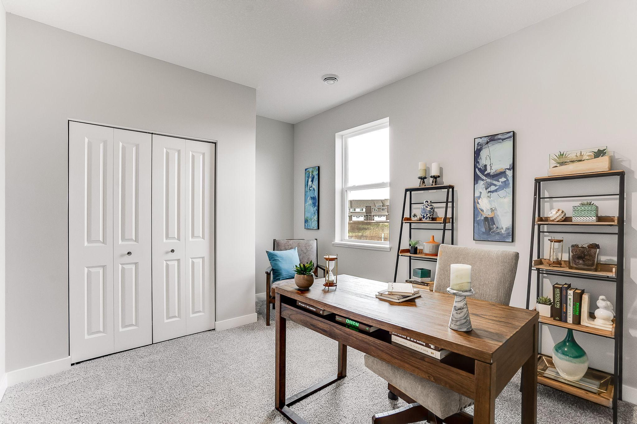 The possibilities are endless in this main level bedroom! *Photo is of a model home.