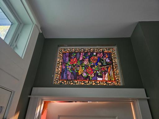 Several beautiful stained glass windows are throughout the home.