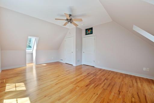 Additional primary bedroom view with door to the closet and the hallway.