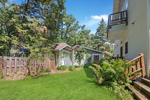 Backyard features extra large shed/garage for storing all your toys, kayaks, bikes, etc.