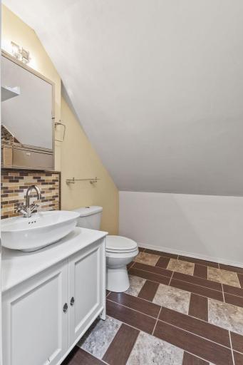 Uppermost level bathroom with laundry!