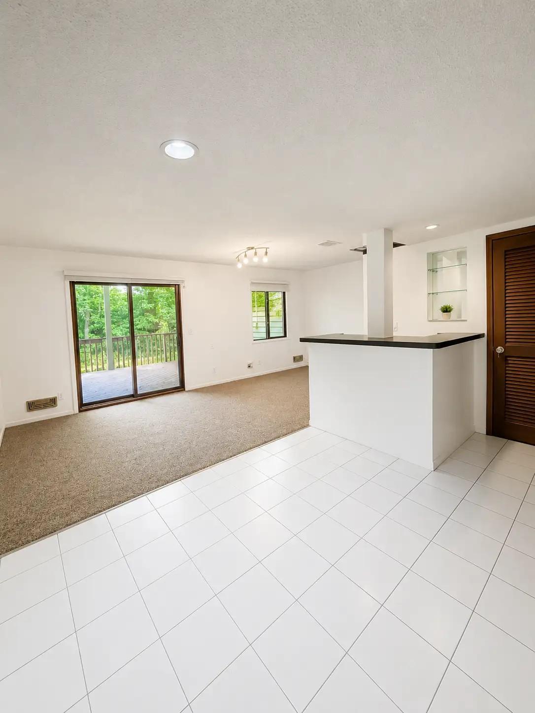 Lower level family room with bar.