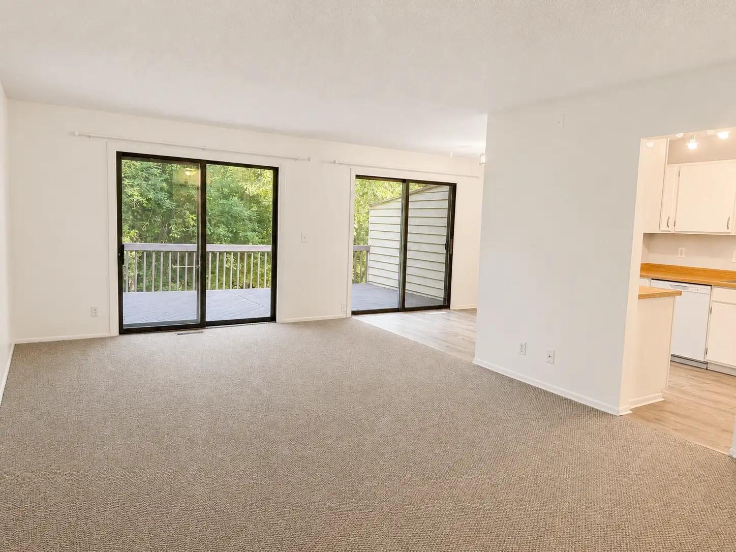 Upper level living room with deck access.