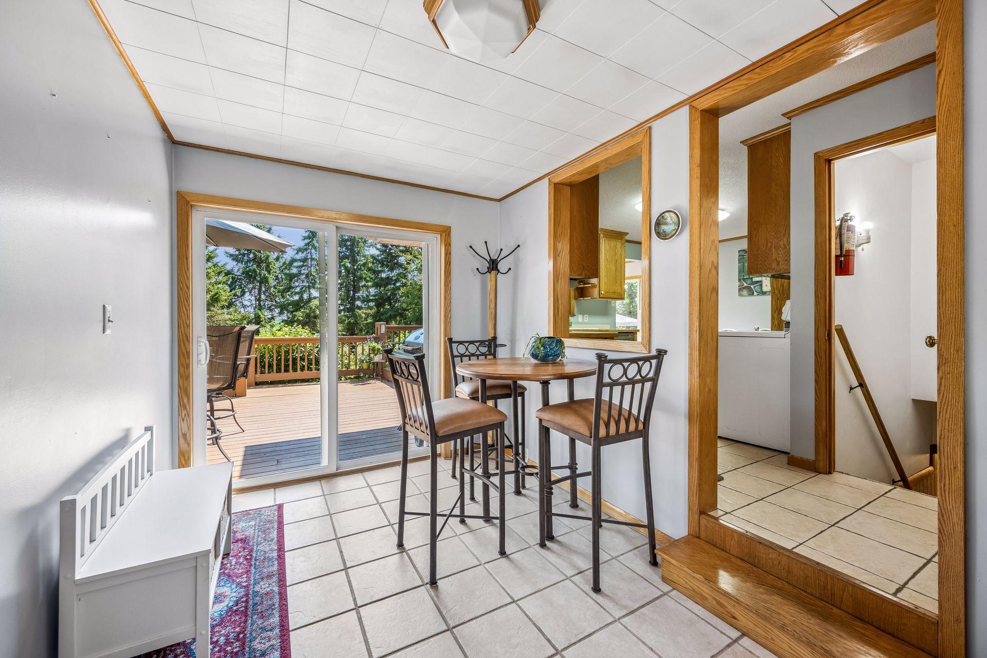 Breezeway between house and garage is a great extra dining & storage/mud room space.
