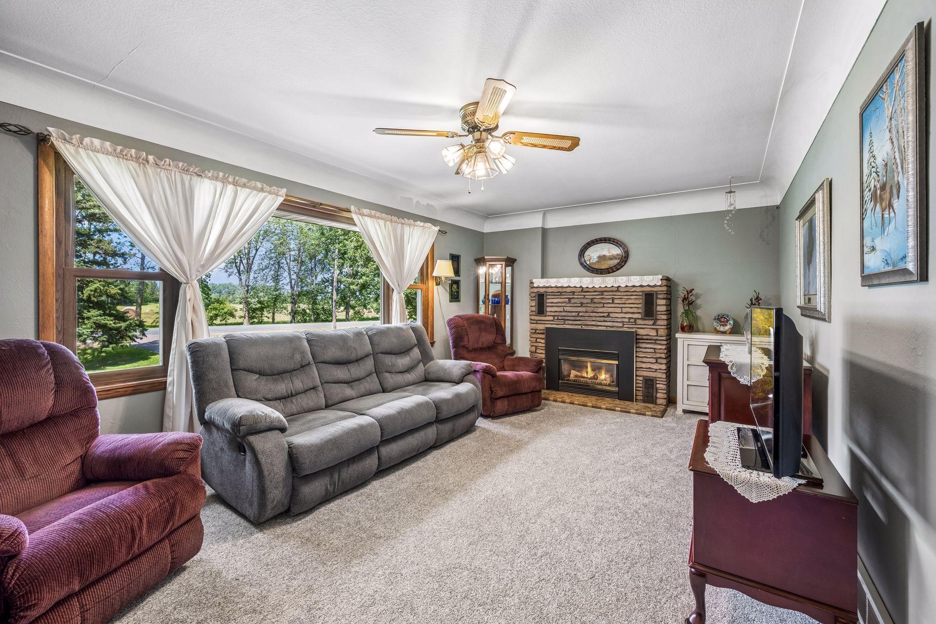 Living room picture window lets in an abundance of natural light.