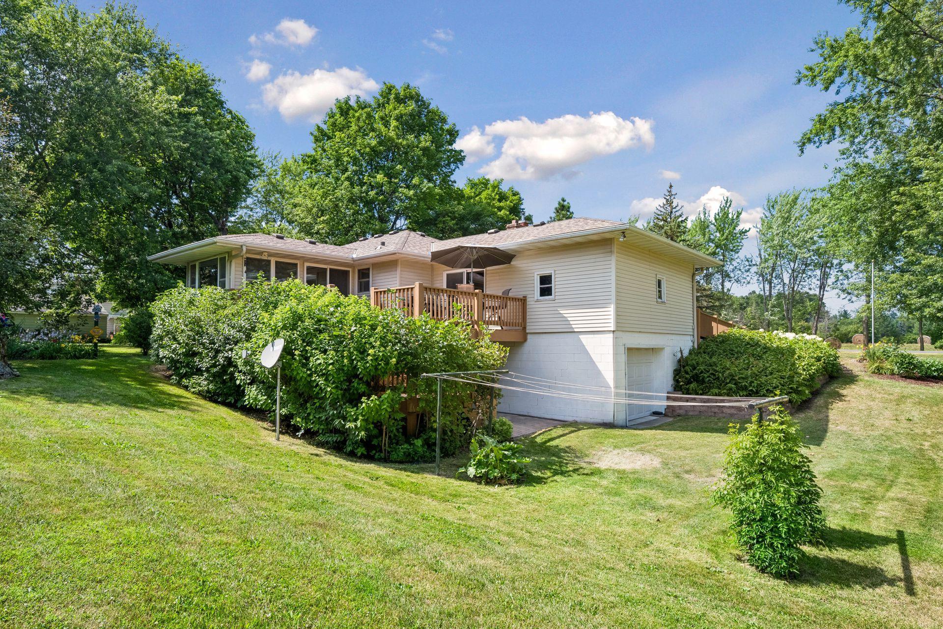 Backyard with view of the tuck under garage