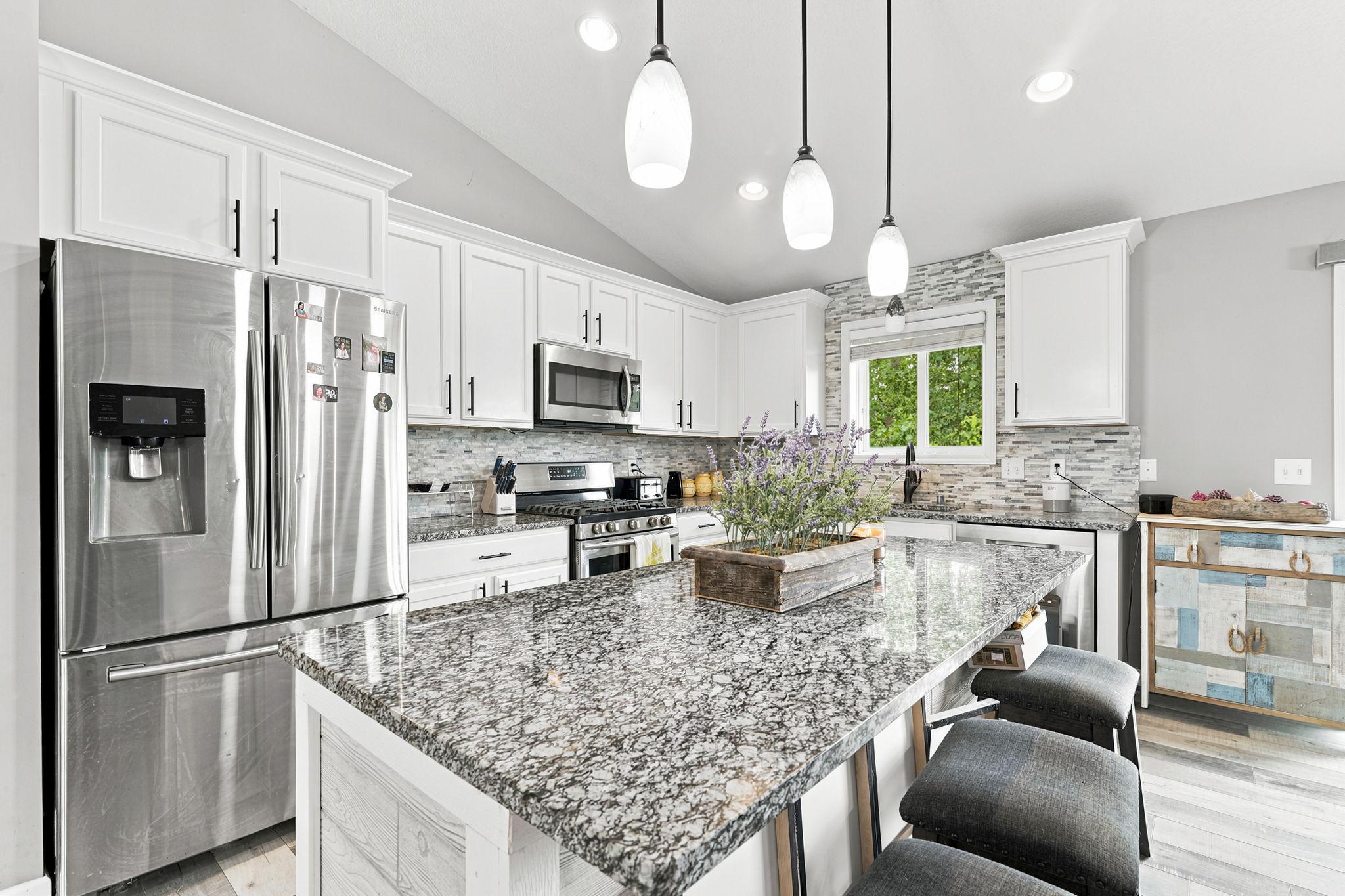 Beautiful Kitchen with a Functional Layout and Stainless Steel Appliances