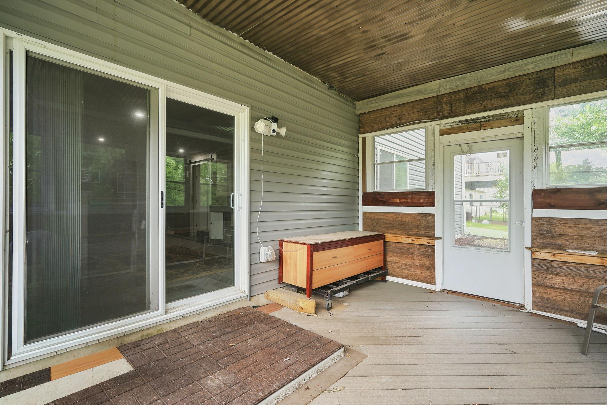 Relax and Unwind in the Inviting 3-Season Porch