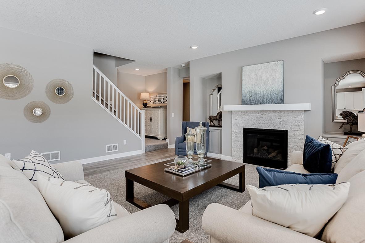 Family room with gas fireplace, abundant space to gather. Photo of model home, color & options may vary.