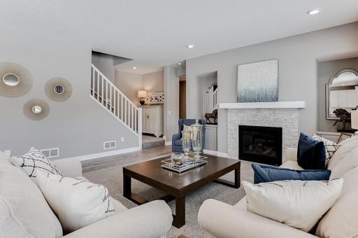 Photo for 23648 Marshview Drive, Rogers, MN 55374 - listing #7113312 Family room with gas fireplace, abundant space to gather. Photo of model home, color & options may vary.